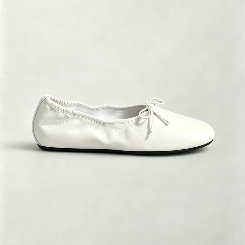 White ballerina shoe on a light gray background