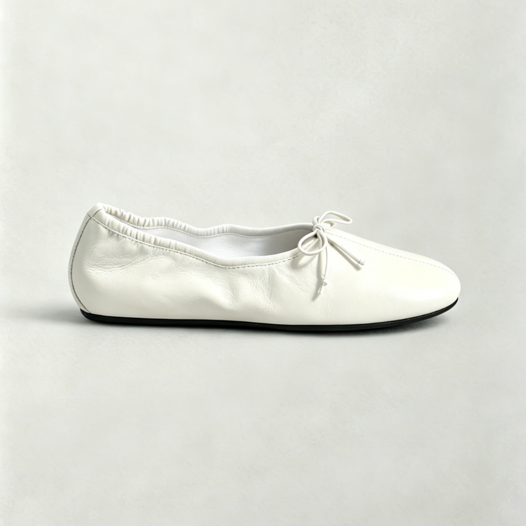 White ballerina shoe on a light gray background