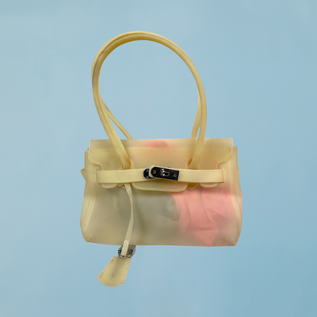 Jelly Firkin 25 Shoulder Bag Butter translucent view on light blue background