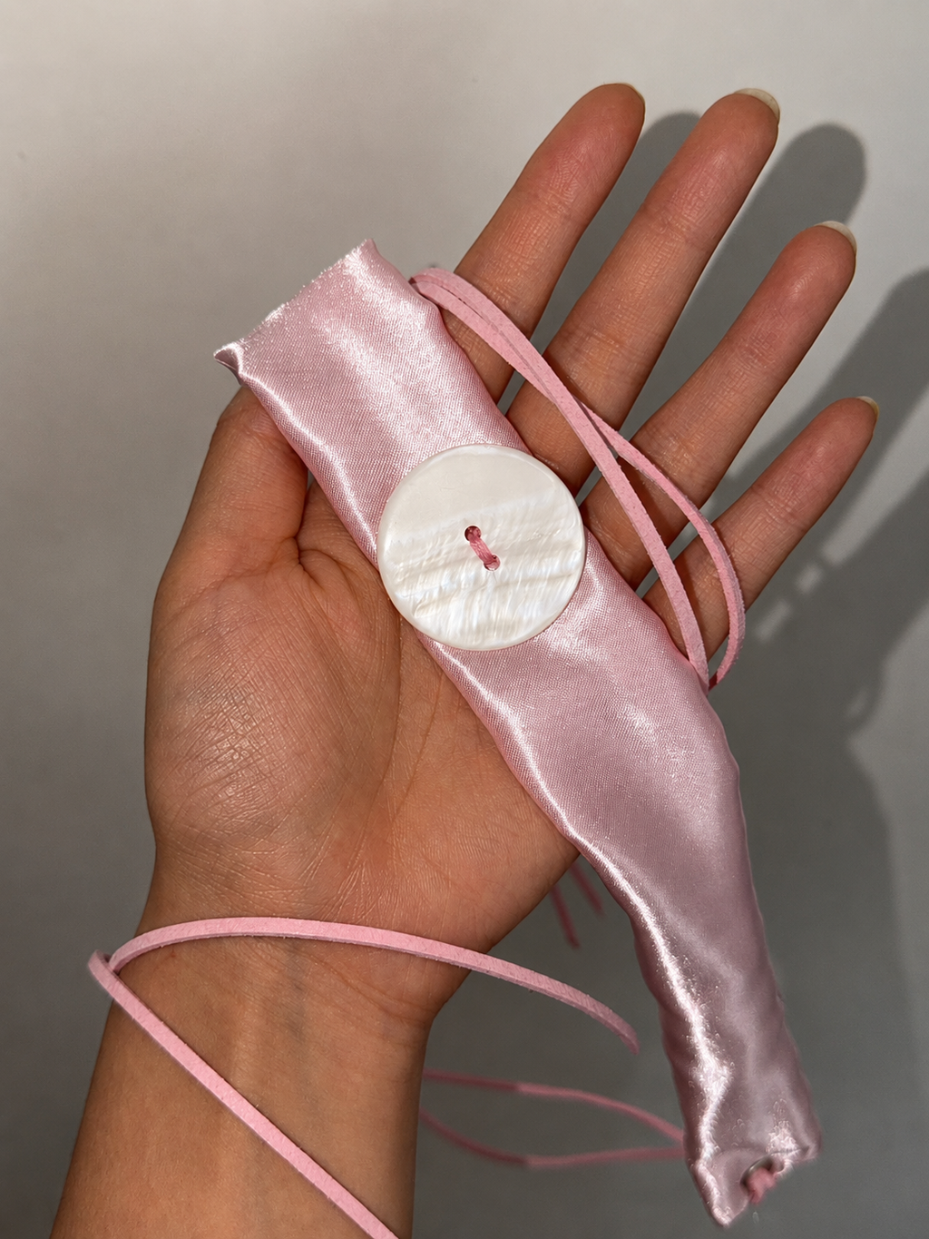 Lovepill Satin Button Choker Strawberry Milk close-up showing button and satin detail