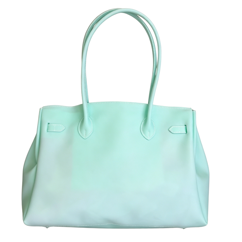 Light blue handbag with a white background