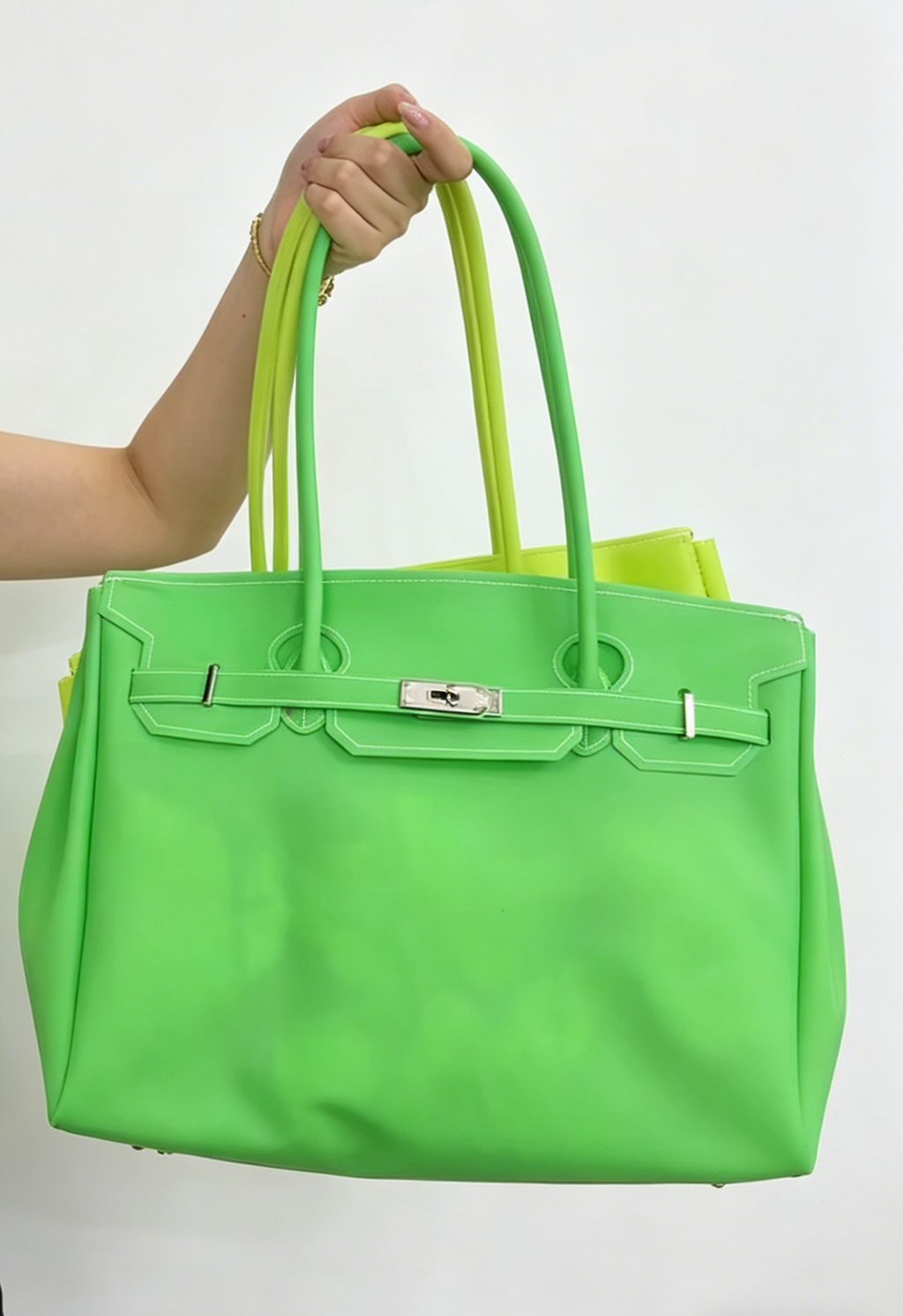 Jelly Firkin 40 Bag Classic Neon Green held by person against white background