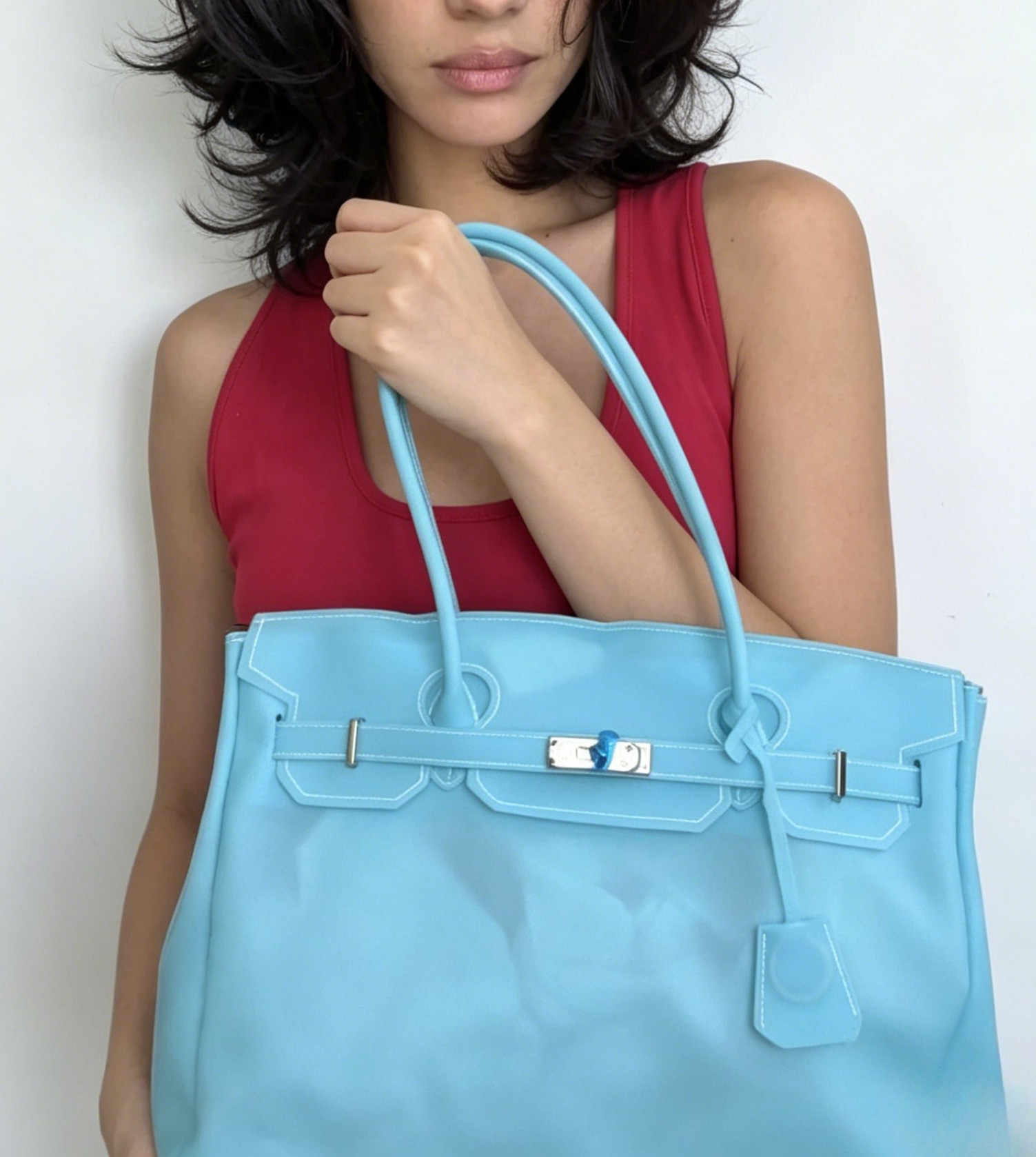 Jelly Firkin 40 Bag Classic Sky Blue held by woman against plain background