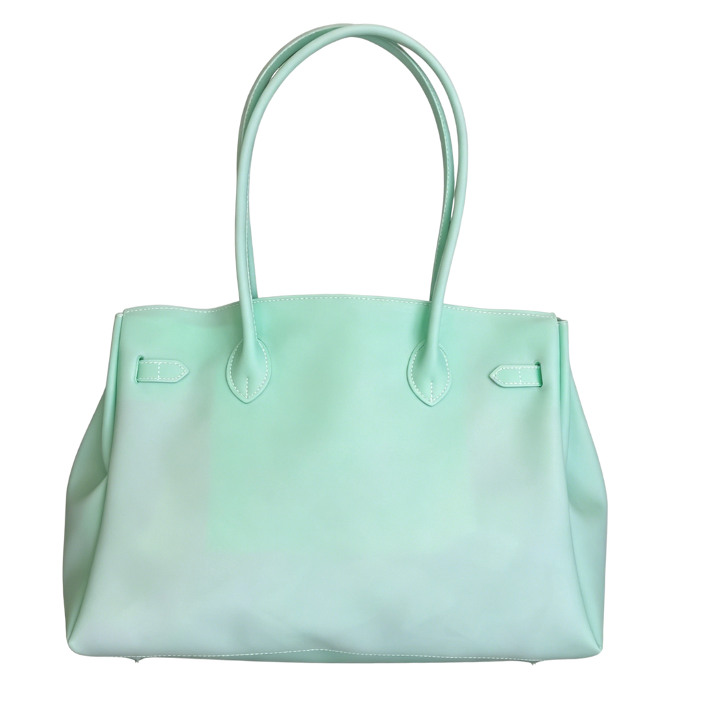 Mint green handbag on a white background