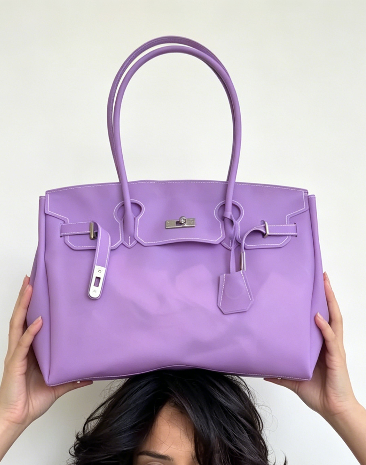 Jelly Firkin 40 Bag Classic Violet held by person against white background